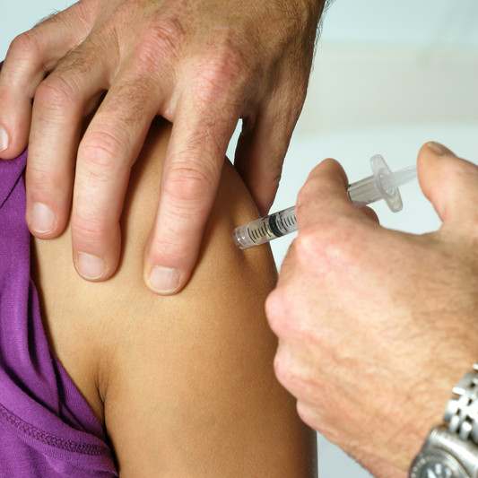 patient receiving immunization injection